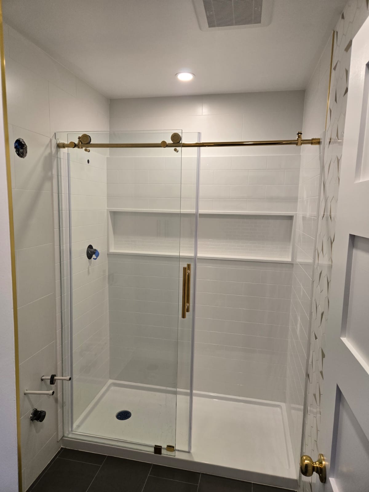 White Tile Shower with Brass